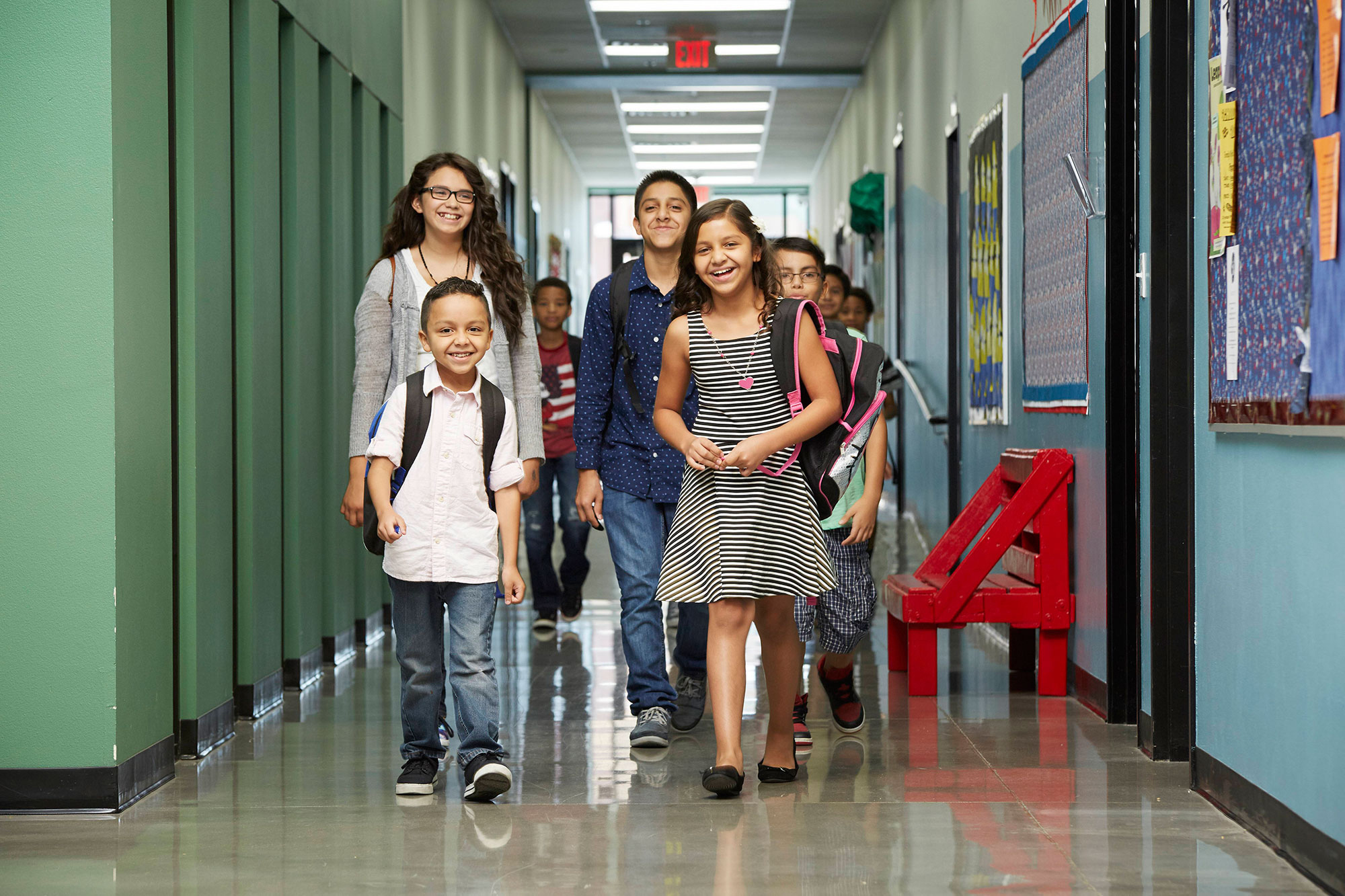 students walking in a school hallway