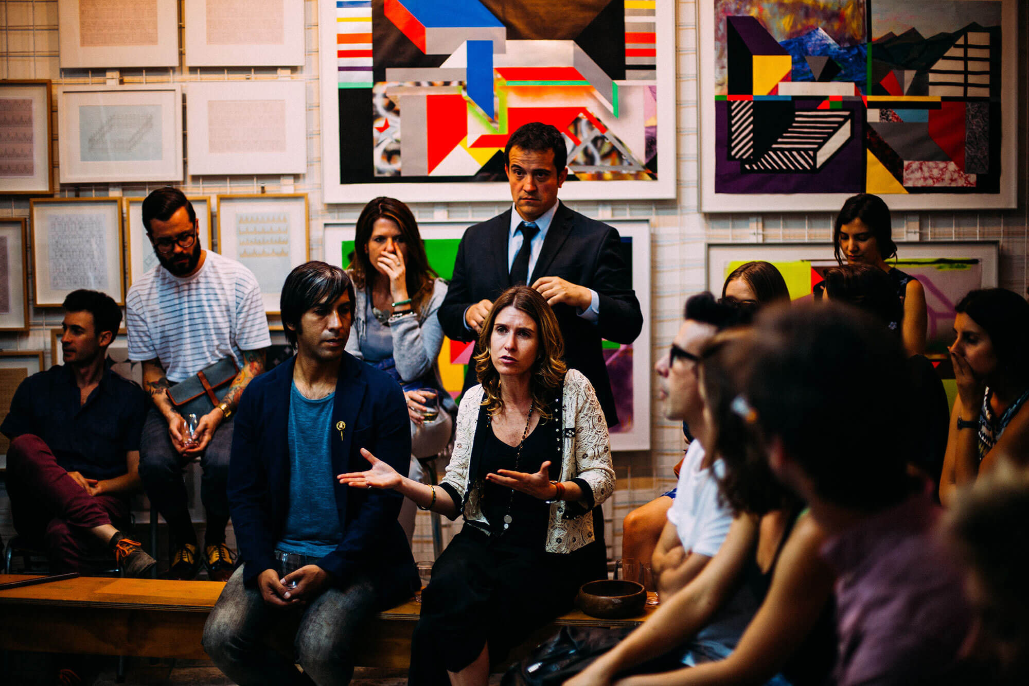 Group of business men and women in a classroom discussion