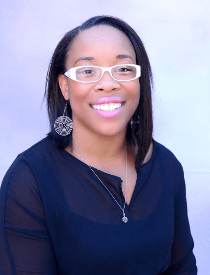 Smiling woman in navy blue shirt