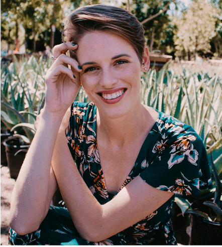 Smiling woman in green dress outdoors