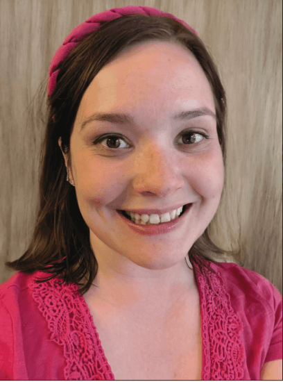 Smiling woman in pink shirt